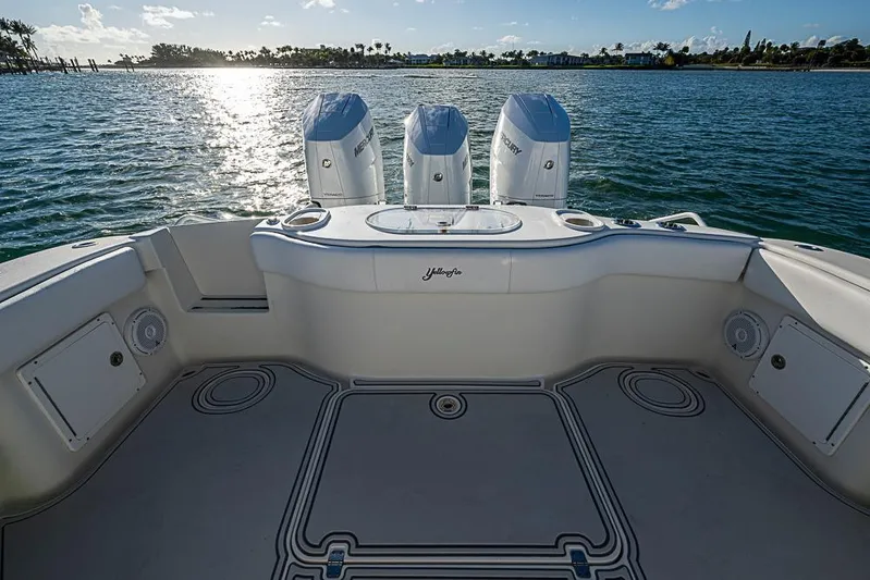Quest Yacht Photos Pics 2011 Yellowfin 39 Offshore boat with triple Mercury engines on calm water.