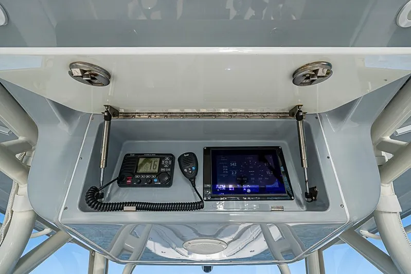Quest Yacht Photos Pics 2011 Yellowfin 39 Offshore boat console with radio and navigation display.