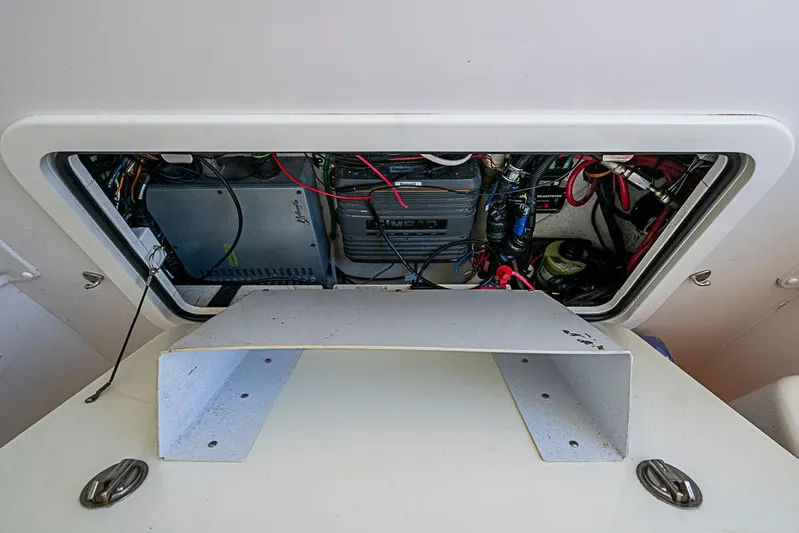 Quest Yacht Photos Pics 2011 Yellowfin 39 Offshore boat electrical compartment with wiring and components.