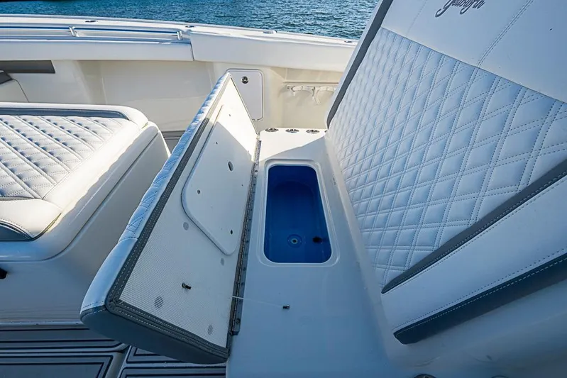 Quest Yacht Photos Pics 2011 Yellowfin 39 Offshore boat with open storage compartment and quilted seating.