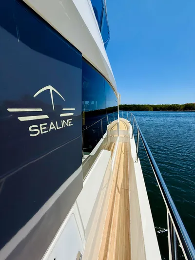 La Vida Boca Yacht Photos Pics 2019 Sealine F430 yacht side view on calm water under clear blue sky.