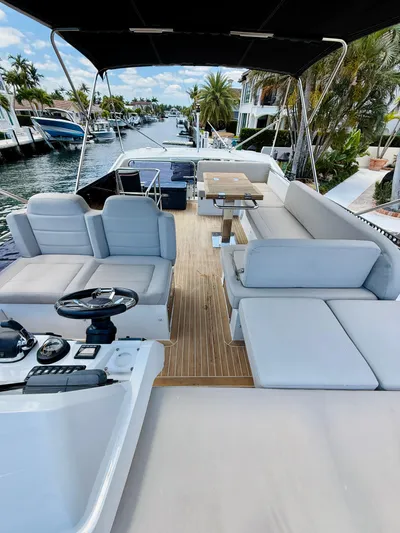 La Vida Boca Yacht Photos Pics 2019 Sealine F430 yacht with spacious deck, modern seating, and waterfront view.