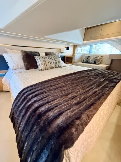 La Vida Boca Yacht Photos Pics Luxurious bedroom interior of 2019 Sealine F430 yacht with elegant bedding and modern design.