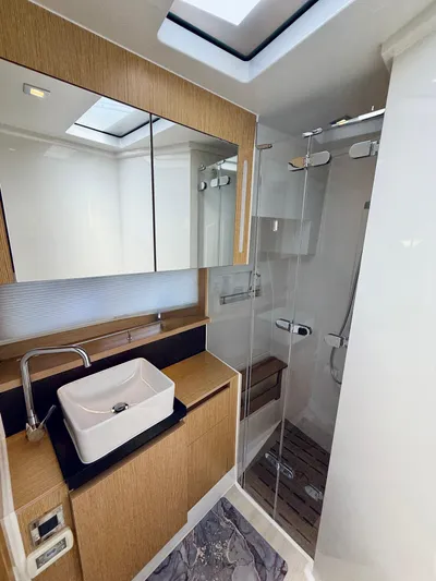La Vida Boca Yacht Photos Pics Luxurious bathroom in 2019 Sealine F430 yacht with modern fixtures and glass shower.