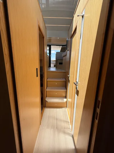 La Vida Boca Yacht Photos Pics Interior hallway of 2019 Sealine F430 yacht with wooden finish and stairs.