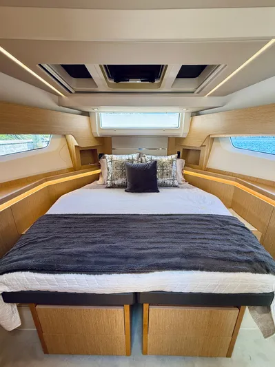 La Vida Boca Yacht Photos Pics Luxurious bedroom interior of 2019 Sealine F430 yacht with modern design and cozy bedding.