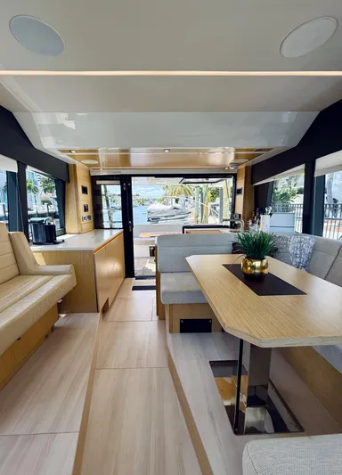 La Vida Boca Yacht Photos Pics Interior of 2019 Sealine F430 yacht, featuring modern dining area and panoramic windows.
