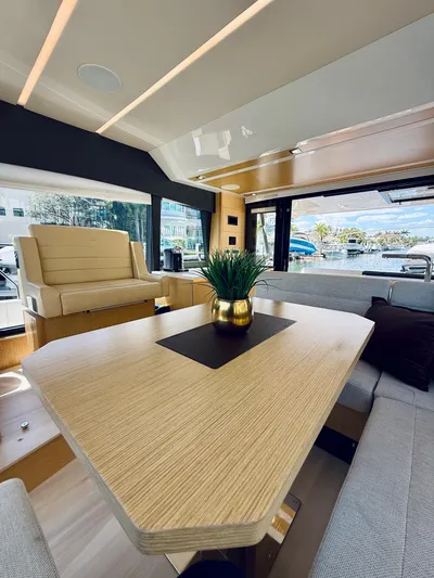 La Vida Boca Yacht Photos Pics Luxurious interior of 2019 Sealine F430 yacht with modern dining area and scenic views.