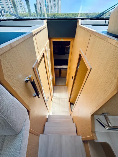 La Vida Boca Yacht Photos Pics Interior view of 2019 Sealine F430 yacht, featuring wooden stairs and modern design.