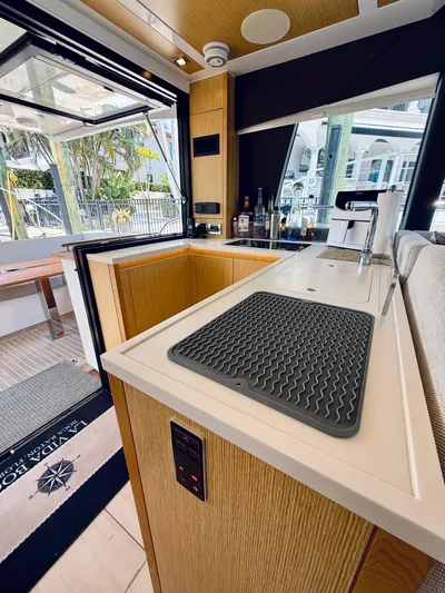 La Vida Boca Yacht Photos Pics Modern kitchen interior of 2019 Sealine F430 yacht with sleek design and outdoor view.