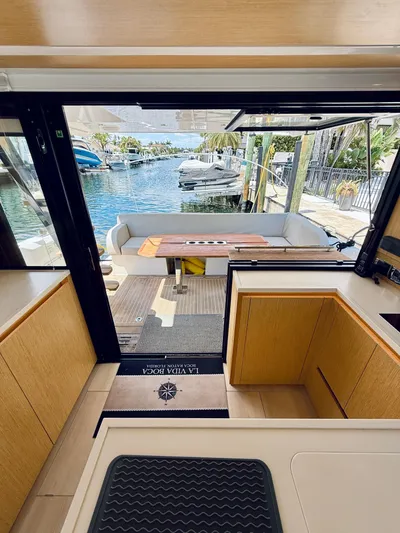 La Vida Boca Yacht Photos Pics Interior view of 2019 Sealine F430 yacht with open deck and waterfront scenery.