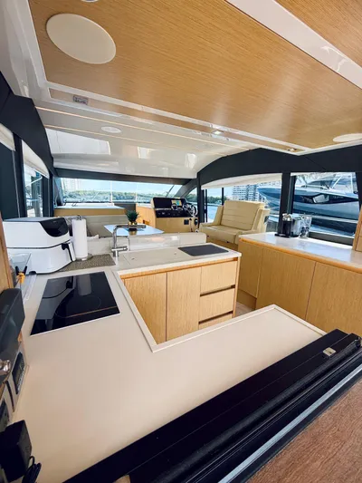 La Vida Boca Yacht Photos Pics Luxurious 2019 Sealine F430 yacht interior with modern kitchen and panoramic windows.