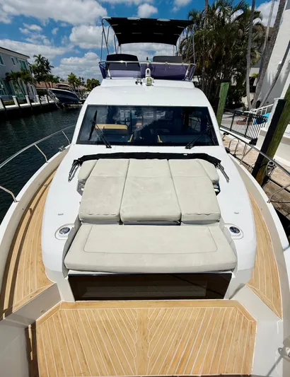 La Vida Boca Yacht Photos Pics 2019 Sealine F430 yacht with sunbathing area, docked in a sunny marina.