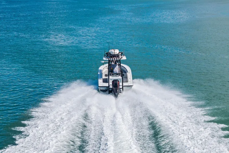  Yacht Photos Pics 2020 Barker Boatworks 26 Open speeding on clear blue water, leaving a wake trail.