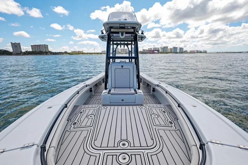  Yacht Photos Pics 2020 Barker Boatworks 26 Open on water, showcasing sleek deck design and city skyline.