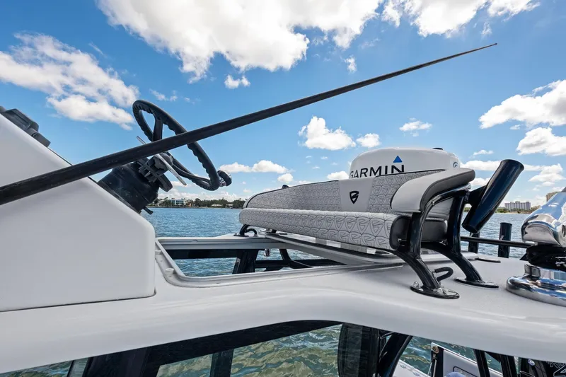  Yacht Photos Pics 2020 Barker Boatworks 26 Open helm with Garmin equipment, under a clear blue sky.