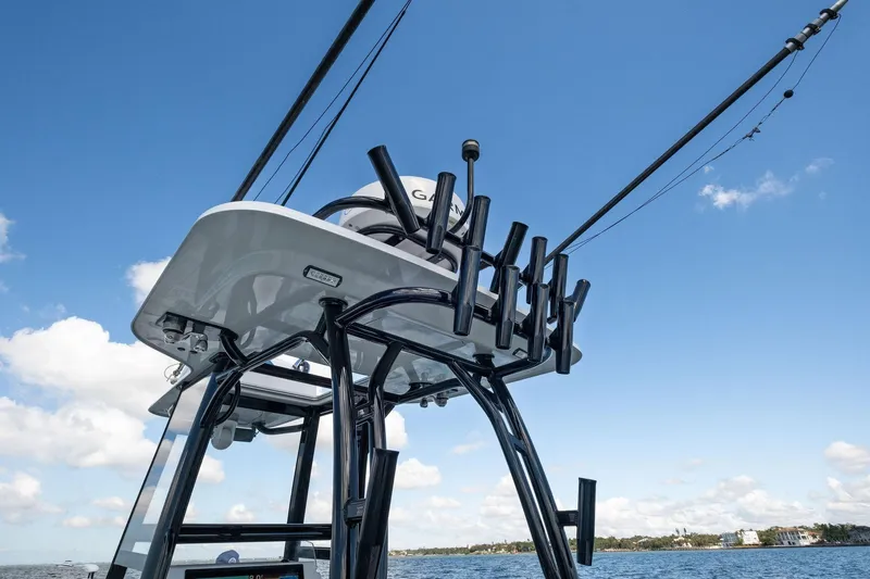 Yacht Photos Pics 2020 Barker Boatworks 26 Open with fishing rod holders against blue sky.
