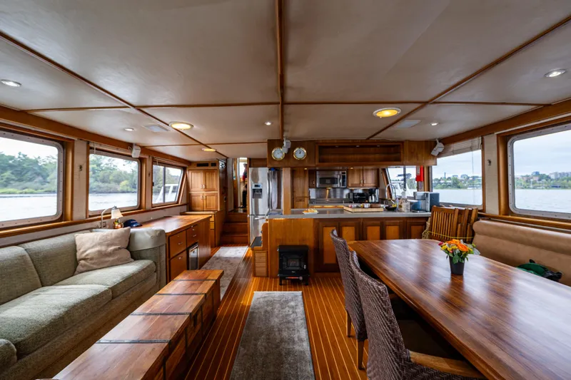 Traveller II Yacht Photos Pics Luxurious 2001 Rodriquez Pilothouse interior with wood finishes and spacious seating.