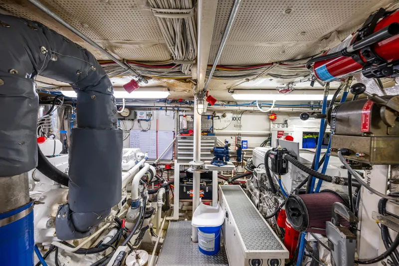 Traveller II Yacht Photos Pics Engine room of a 2001 Rodriquez Pilothouse yacht, showcasing machinery and equipment.