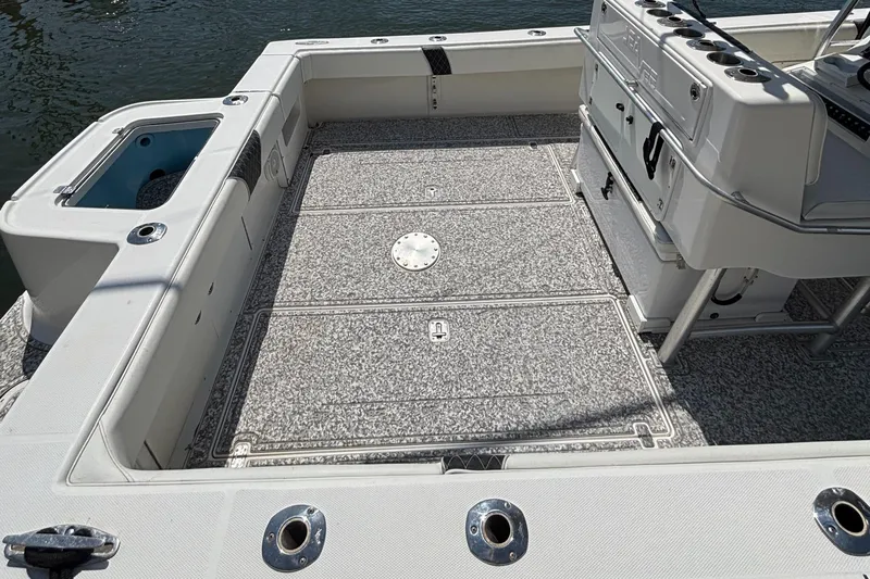  Yacht Photos Pics 2004 SeaVee 34 boat deck with fishing rod holders and storage compartments.