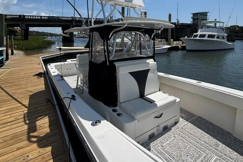  Yacht Photos Pics 2004 SeaVee 34 boat docked, featuring a spacious deck and sleek design.