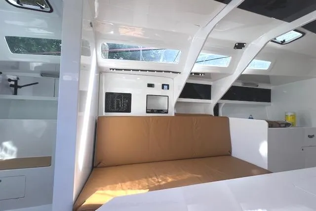 Bellissimo Yacht Photos Pics Interior of 2024 Neo 43 Romo yacht with modern design and beige seating.