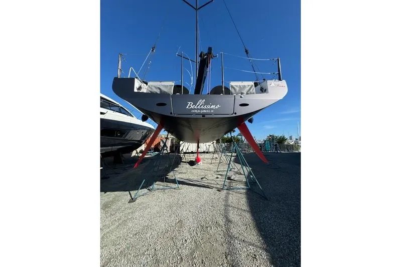 Bellissimo Yacht Photos Pics Sailboat Neo 43 Romo 2024 on stands, viewed from stern, clear sky background.