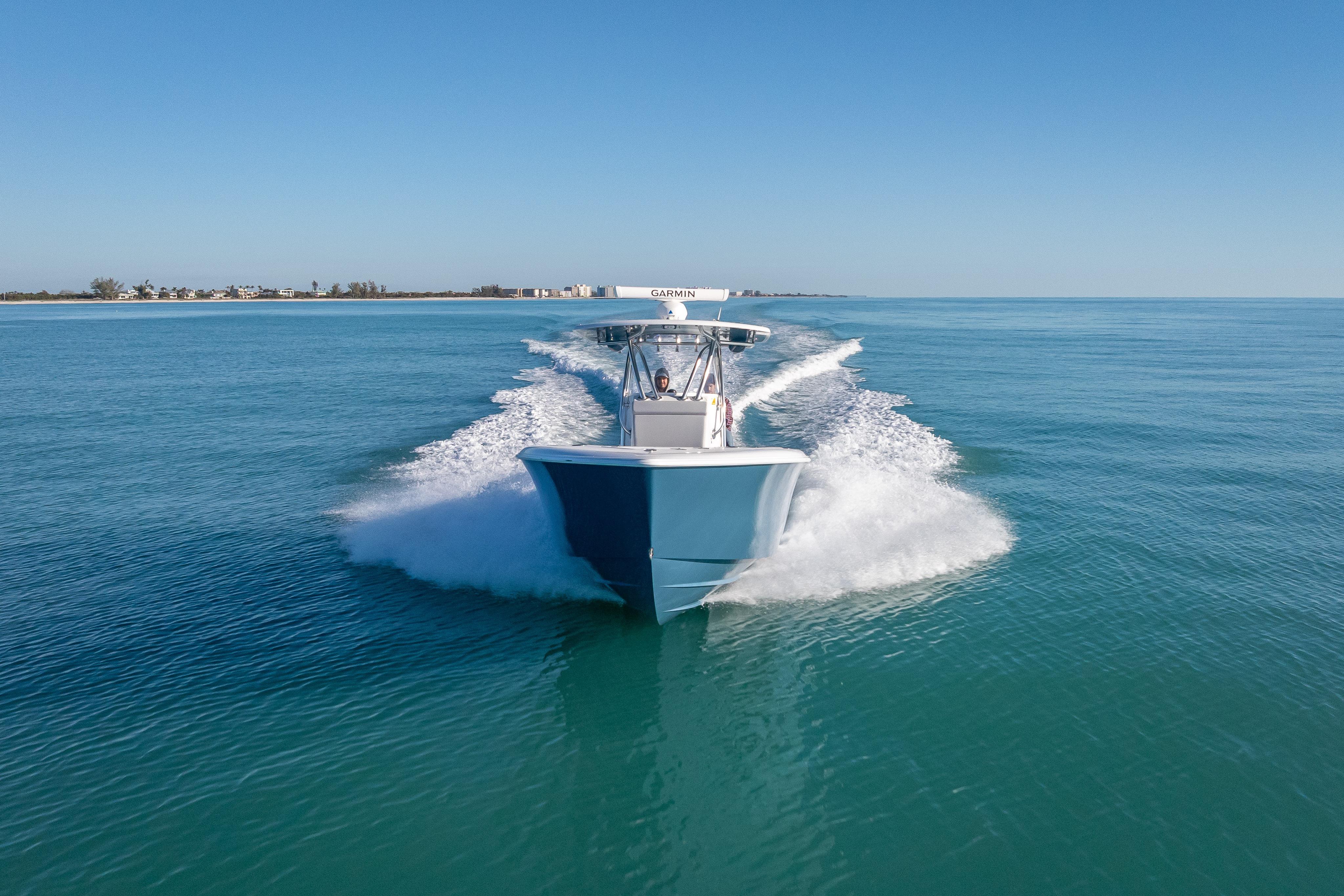 2026 Contender 35 ST boat cruising on clear blue ocean waters.