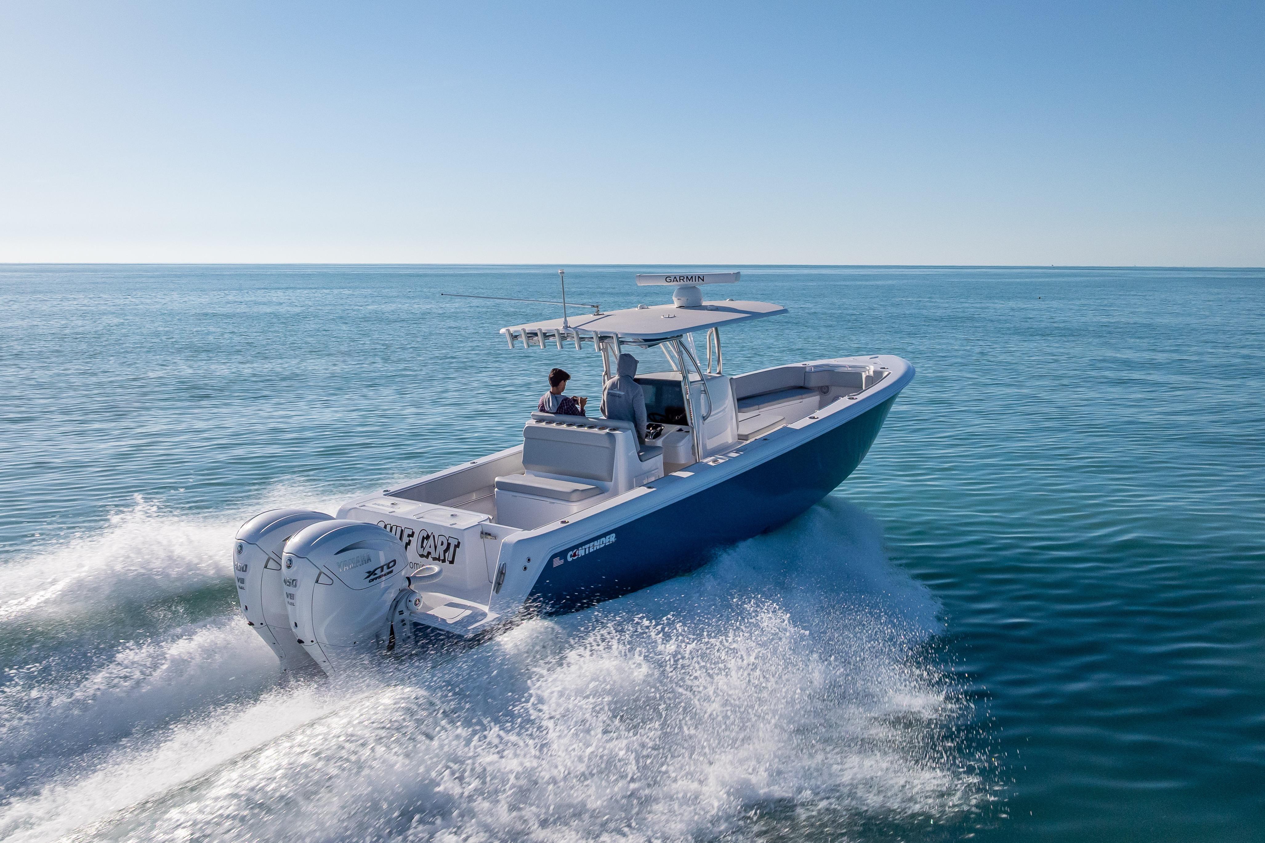 2026 Contender 35 ST boat cruising on open water, showcasing powerful twin engines.