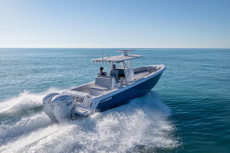  Yacht Photos Pics 2026 Contender 35 ST boat cruising on open water, showcasing powerful twin engines.