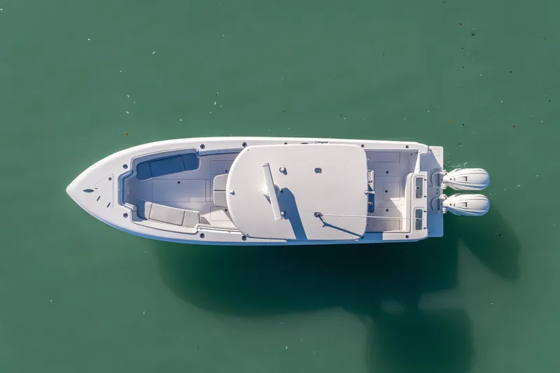  Yacht Photos Pics Aerial view of 2026 Contender 35 ST boat on calm green water.