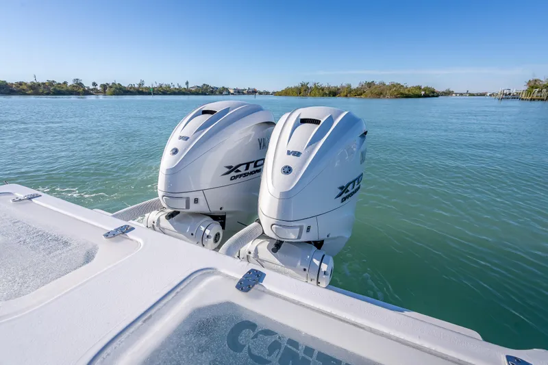  Yacht Photos Pics 2026 Contender 35 ST boat with dual Yamaha XTO Offshore V8 engines on calm water.