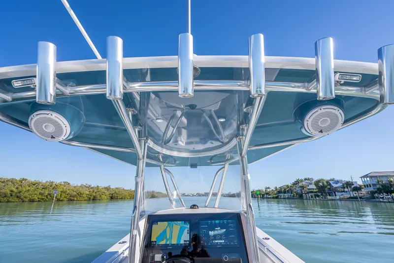  Yacht Photos Pics 2026 Contender 35 ST boat with advanced navigation system and sleek design on calm waters.