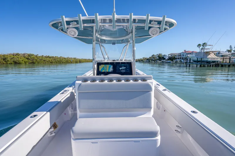  Yacht Photos Pics 2026 Contender 35 ST boat on calm water, featuring sleek design and advanced navigation system.