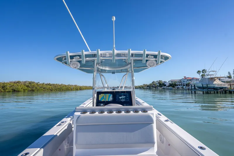  Yacht Photos Pics 2026 Contender 35 ST boat on calm water, clear blue sky, modern dashboard.