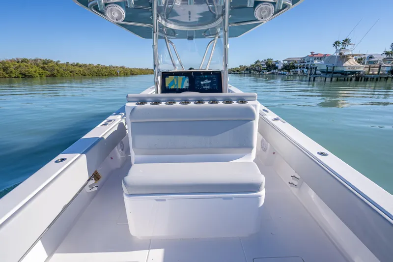  Yacht Photos Pics 2026 Contender 35 ST boat interior with seating and navigation system on calm water.