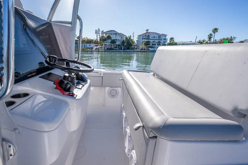 Yacht Photos Pics Interior view of 2026 Contender 35 ST boat, featuring helm and seating area.