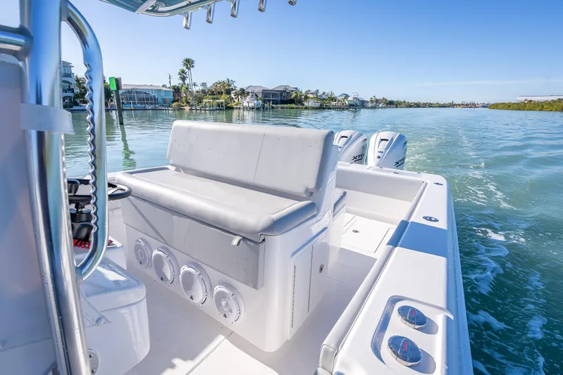  Yacht Photos Pics 2026 Contender 35 ST boat cruising on a sunny day, showcasing sleek design and powerful engines.