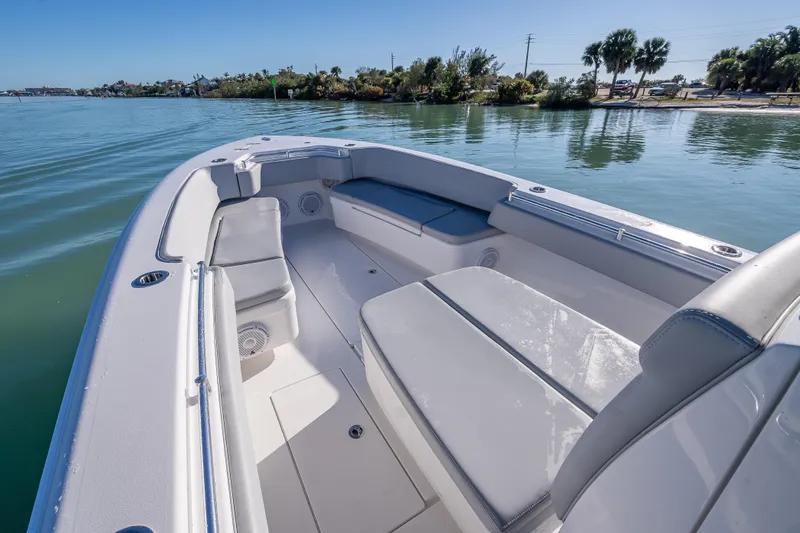  Yacht Photos Pics 2026 Contender 35 ST boat interior with cushioned seating on calm water.