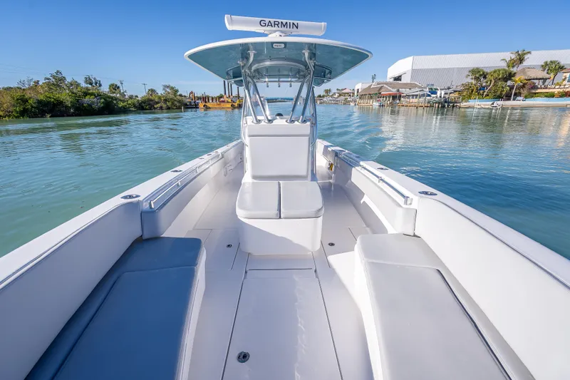  Yacht Photos Pics 2026 Contender 35 ST boat on calm water, featuring spacious seating and Garmin equipment.