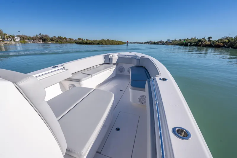  Yacht Photos Pics 2026 Contender 35 ST boat interior with sleek seating on calm water.
