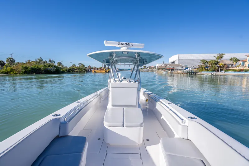  Yacht Photos Pics 2026 Contender 35 ST boat on calm water, featuring Garmin navigation system.
