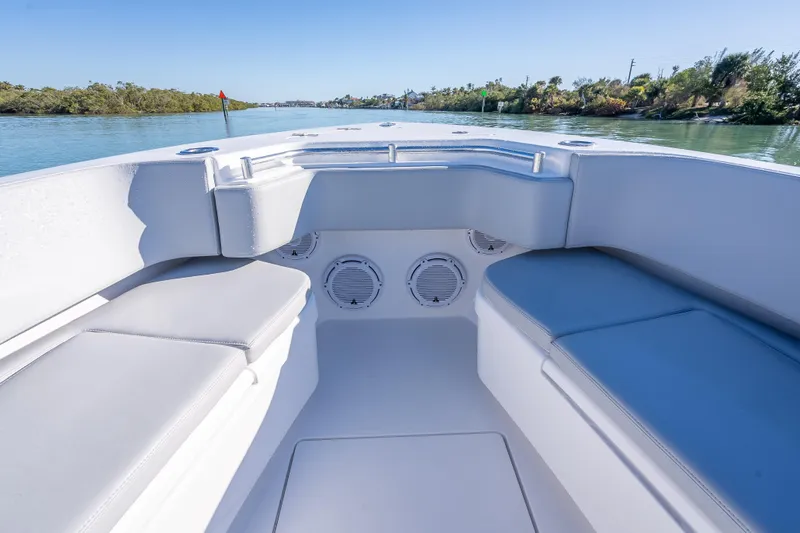 Yacht Photos Pics 2026 Contender 35 ST boat interior with cushioned seating and scenic waterway view.