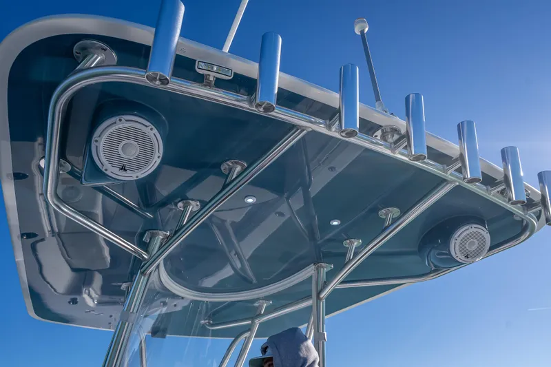  Yacht Photos Pics 2026 Contender 35 ST boat with sleek T-top and integrated speakers against blue sky.