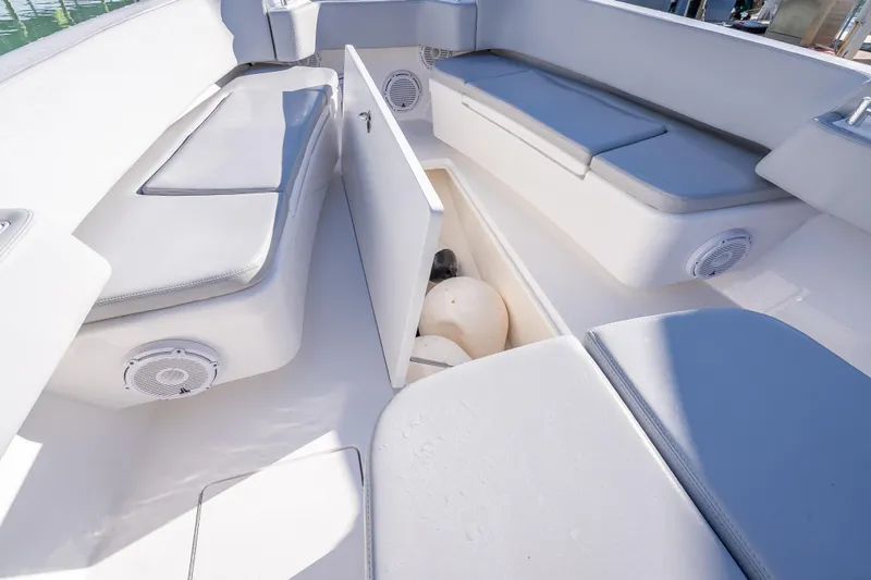  Yacht Photos Pics 2026 Contender 35 ST boat interior with cushioned seating and storage compartment.