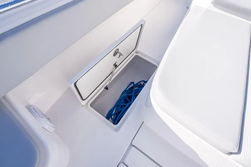  Yacht Photos Pics 2026 Contender 35 ST boat storage compartment with blue rope inside.