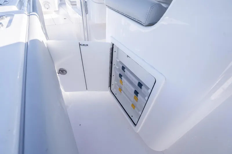  Yacht Photos Pics 2026 Contender 35 ST boat interior storage compartment with open door.