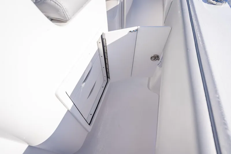  Yacht Photos Pics 2026 Contender 35 ST boat interior storage compartment with open door.