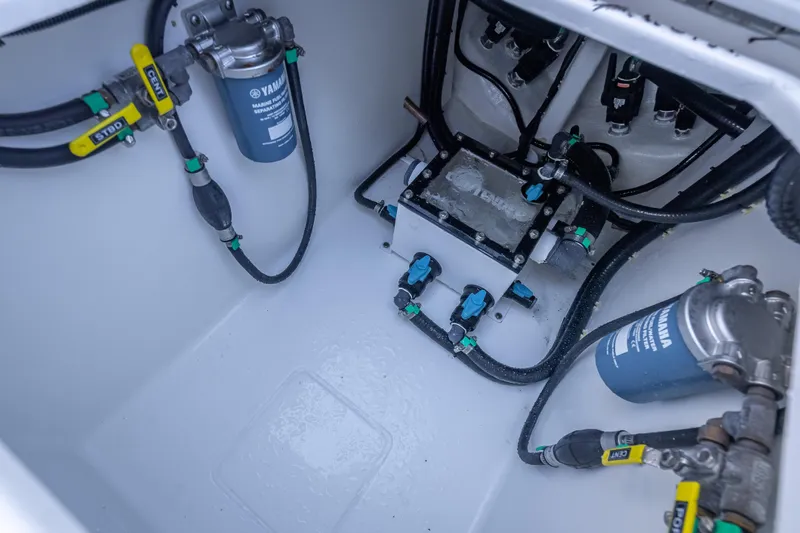  Yacht Photos Pics 2026 Contender 35 ST boat engine compartment with Yamaha fuel filters and hoses.