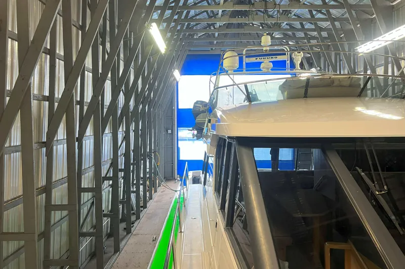 Dream Catcher Yacht Photos Pics 1998 West Bay 58 yacht in a boat shed, showcasing its sleek design and modern equipment.